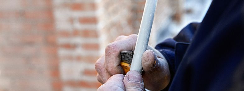 Low voltage cable being scaled by installer